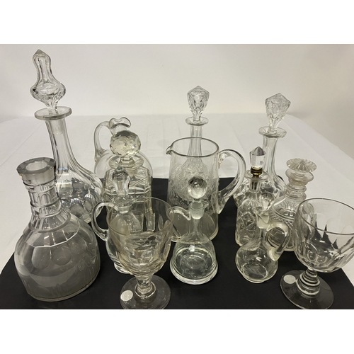 49 - A lot of glass decanters, jugs and glasses. (14)