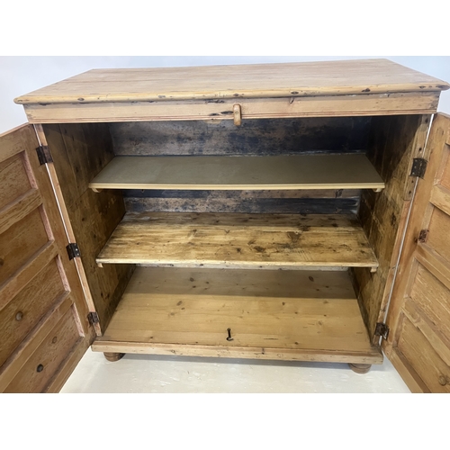 55 - Antique pine chest fitted with a dummy drawer cupboard doors with shelf interior. W. 125cm, D. 59cm,... 