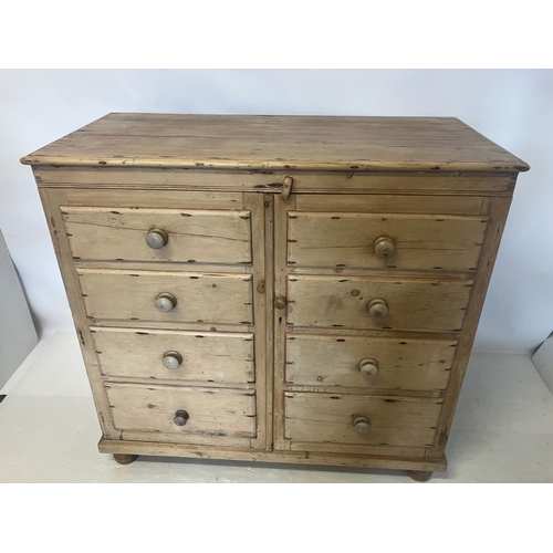 55 - Antique pine chest fitted with a dummy drawer cupboard doors with shelf interior. W. 125cm, D. 59cm,... 