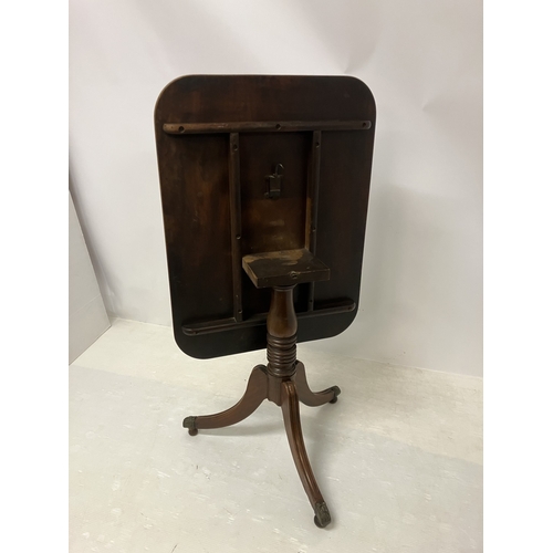83 - Regency mahogany wine or tea table raised on turned column and tripod base with brass toe castors. W... 