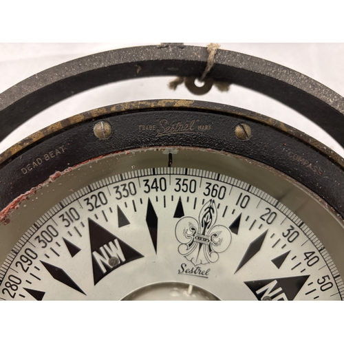 90 - Heavy antique brass case compass on swivel by Henry Browne & Son together with a pressure gauge and ... 