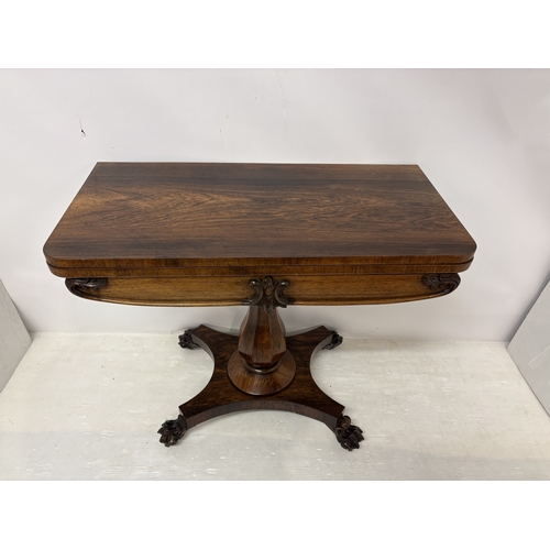 95 - Victorian rosewood fold over card table raised on centre column, platform base and 4 carved feet. W.... 