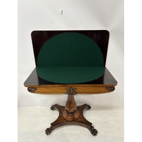 95 - Victorian rosewood fold over card table raised on centre column, platform base and 4 carved feet. W.... 