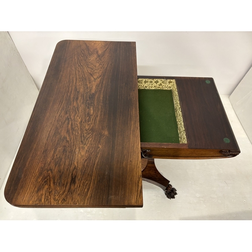 95 - Victorian rosewood fold over card table raised on centre column, platform base and 4 carved feet. W.... 