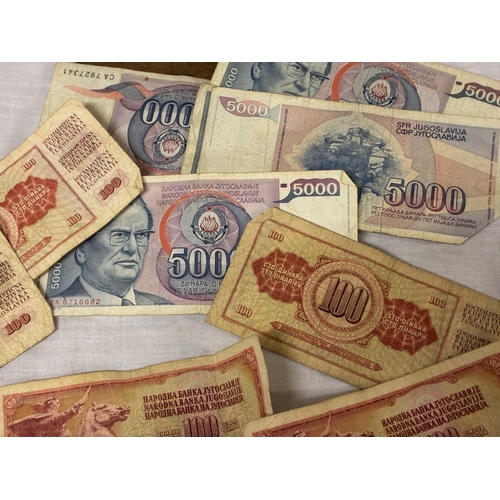 Box of coins & foreign bank notes.