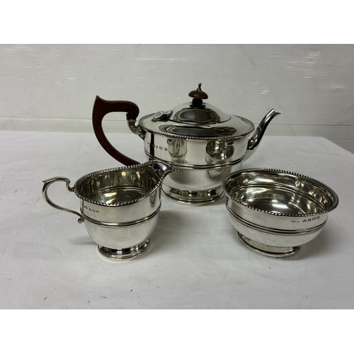 Three piece English silver tea service, Birmingham 1931, 27 troy ozs.