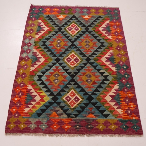 A Kilm rug with geometric design. 148cm x 105cm.
