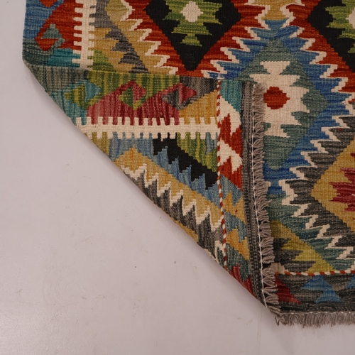 A Kilm rug with geometric design. L 150cm, W. 103cm.