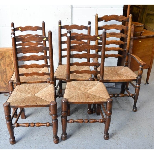 481 - Four 19th century ladder back chairs and one carver, with rush seats.