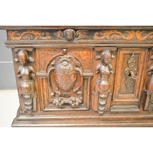 489 - A late 16th century oak and walnut marriage chest, painted with pregnant women, and catholic motifs,... 