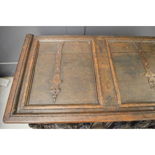 489 - A late 16th century oak and walnut marriage chest, painted with pregnant women, and catholic motifs,... 