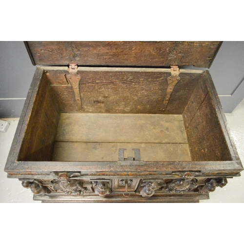489 - A late 16th century oak and walnut marriage chest, painted with pregnant women, and catholic motifs,... 