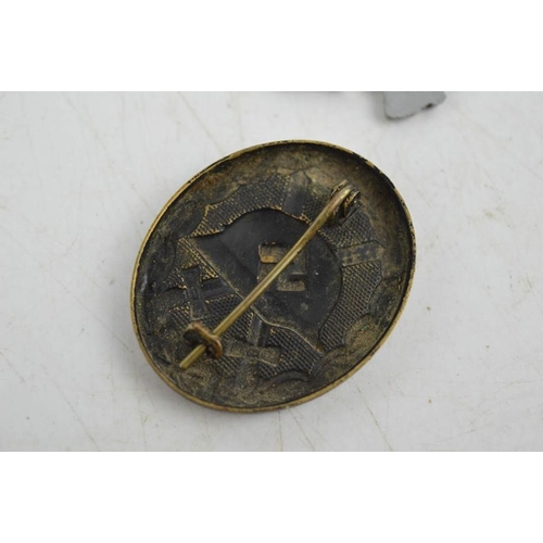 11 - A German Nazi WWII pin and badge.