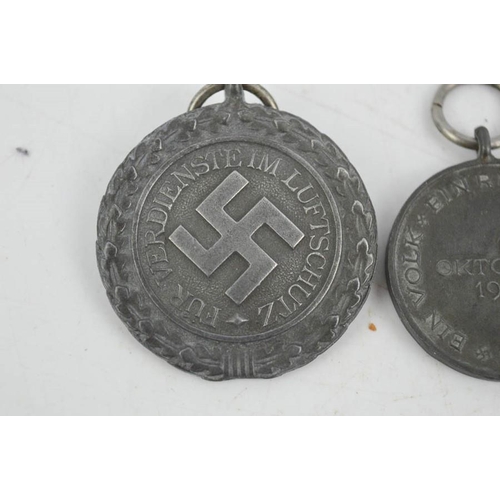 3 - A German Luftshutz medal and an Austrian medal.