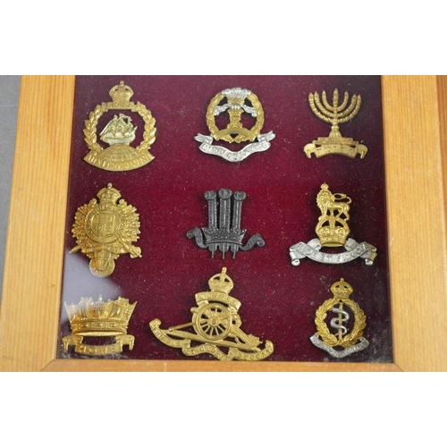 30 - Two framed sets of cap badges.