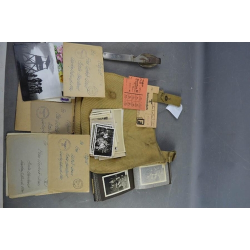 34 - A German WWI  Bread bag with effects of WWII German solider with photos and letters, knife and fork ... 