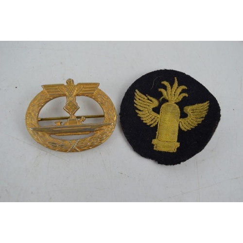 45 - A German U-Boot Kriegsabzeichen submarine war badge, bearing makers marks and a Torpedo badge.