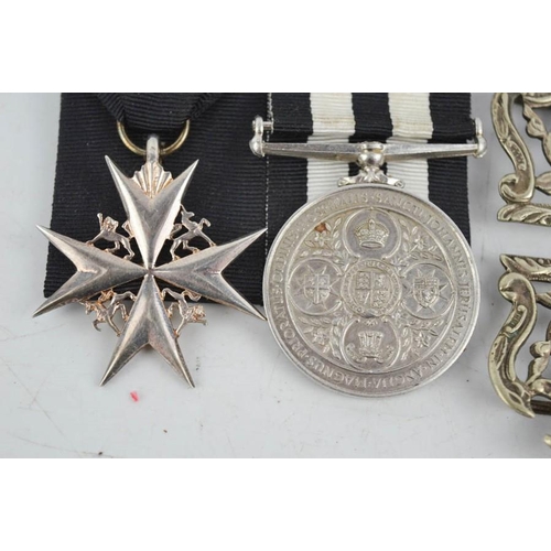 53 - A King Crown WWII St Johns Ambulance Court mounted medal, together with a silver plated nurses belt ... 