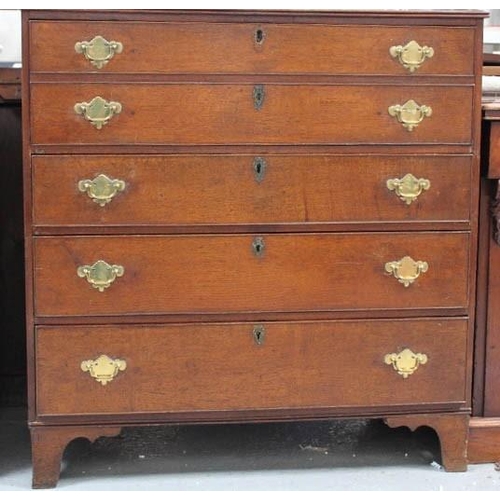 536 - A Georgian oak secretaire chest, the two dummy drawers fold down to reveal a fitted interior of draw... 