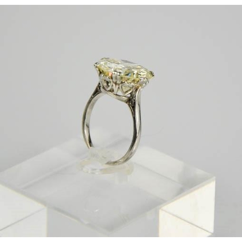 54 - A platinum diamond solitaire ring, the brilliant cut 9.35ct diamond in a six double claw setting, 6.... 