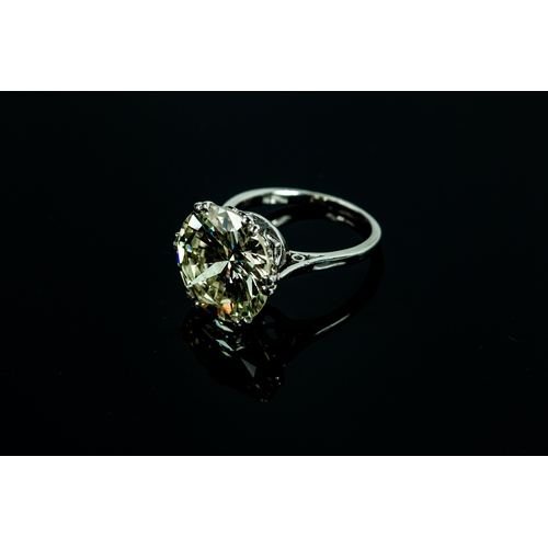 54 - A platinum diamond solitaire ring, the brilliant cut 9.35ct diamond in a six double claw setting, 6.... 