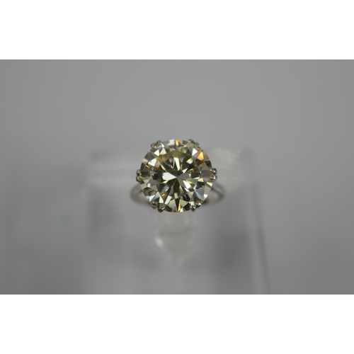 54 - A platinum diamond solitaire ring, the brilliant cut 9.35ct diamond in a six double claw setting, 6.... 