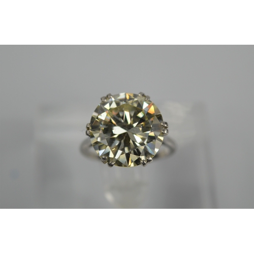 54 - A platinum diamond solitaire ring, the brilliant cut 9.35ct diamond in a six double claw setting, 6.... 