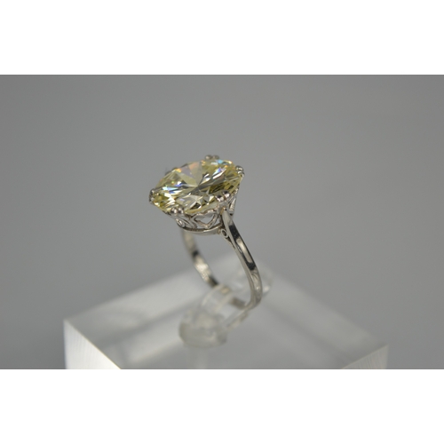 54 - A platinum diamond solitaire ring, the brilliant cut 9.35ct diamond in a six double claw setting, 6.... 