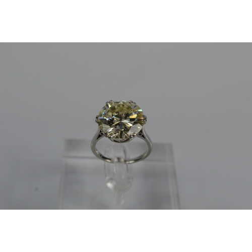 54 - A platinum diamond solitaire ring, the brilliant cut 9.35ct diamond in a six double claw setting, 6.... 