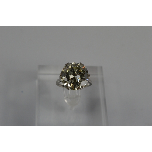 54 - A platinum diamond solitaire ring, the brilliant cut 9.35ct diamond in a six double claw setting, 6.... 