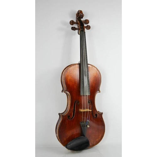 A violin labelled Joseph Guarnerius fecit Cremonae anno 1726 IHS, the  two-piece back of medium curl,