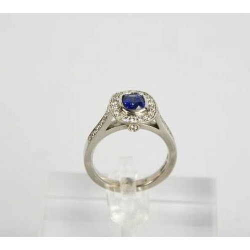 107 - An 18ct white gold sapphire and diamond ring, the sapphire approximately 0.90ct, the diamodns totall... 