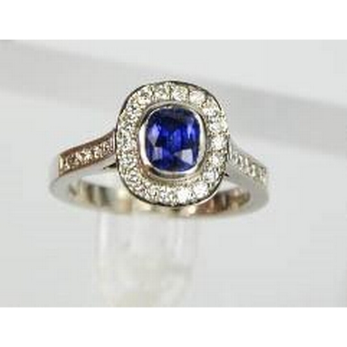 107 - An 18ct white gold sapphire and diamond ring, the sapphire approximately 0.90ct, the diamodns totall... 