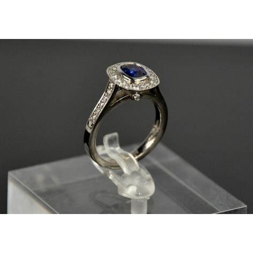 107 - An 18ct white gold sapphire and diamond ring, the sapphire approximately 0.90ct, the diamodns totall... 