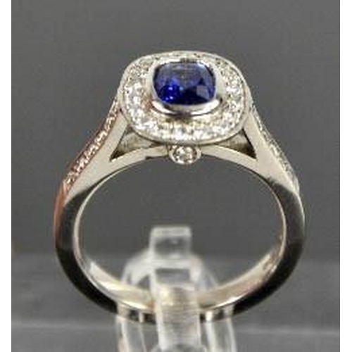 107 - An 18ct white gold sapphire and diamond ring, the sapphire approximately 0.90ct, the diamodns totall... 