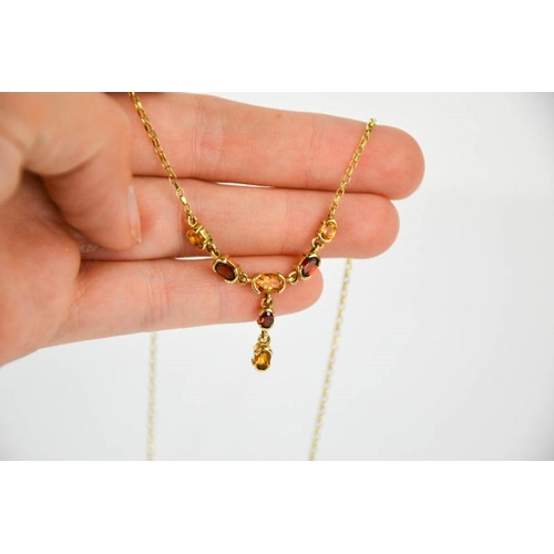 108 - A 9ct gold, citrine and garnet necklace, 4.4g.