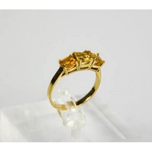 112 - A 9ct yellow gold and citrine ring, set with three square cut citrines, size R, 3.1g.