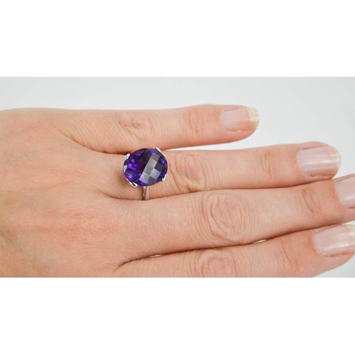 13 - A 9ct white gold and amethyst cocktail ring, size O, 4.1g.