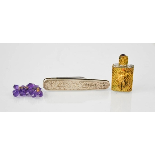 57 - A silver fruit knife, Sheffield 1952, engraved with scrolling foliage and initials S V H, together w... 