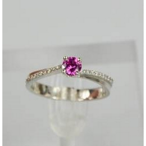 58 - A 14ct white gold, pink sapphire and diamond ring, the sapphire approximately 0.5cts, size O½, 3.4g.