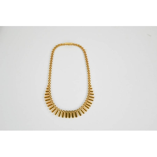 59 - A 9ct gold flat link Egyptian style necklace, in presentation case, 42cm long, 21g.