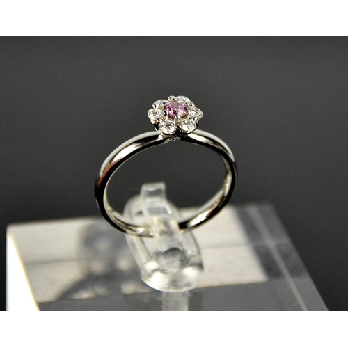 60 - A platinum, pink and white diamond flower head ring, the central diamond 0.12ct, size M, 4.6g.