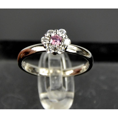 60 - A platinum, pink and white diamond flower head ring, the central diamond 0.12ct, size M, 4.6g.