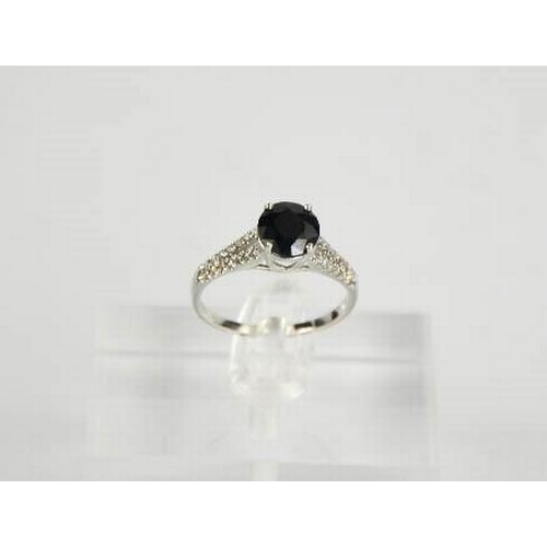 63 - A 14ct white gold, black sapphire and diamond ring, size M, 2.3g.