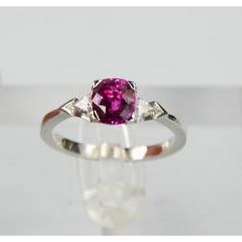 65 - An 18ct white gold, pink sapphire and diamond ring, the sapphire approximately 1ct, the diamonds 0.2... 