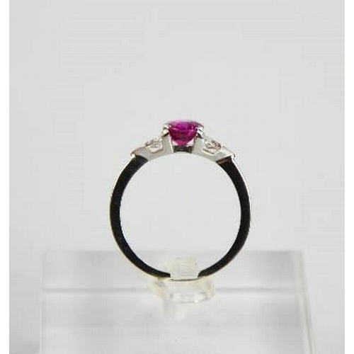 65 - An 18ct white gold, pink sapphire and diamond ring, the sapphire approximately 1ct, the diamonds 0.2... 