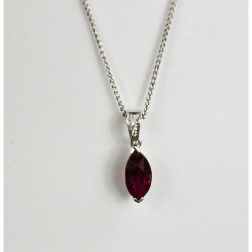 67 - An 18ct white gold, ruby and diamond pendant and chain, the ruby 2ct, the diamonds set to the hoop, ... 