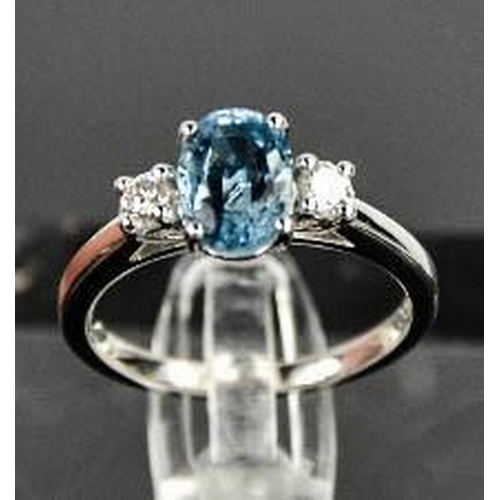 69 - An 18ct white gold, aquamarine and diamond ring, the 1.20ct aquamarine flanked by 0.20cts diamonds i... 