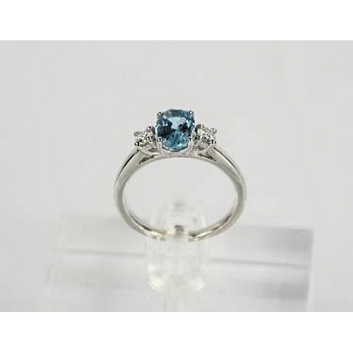 69 - An 18ct white gold, aquamarine and diamond ring, the 1.20ct aquamarine flanked by 0.20cts diamonds i... 