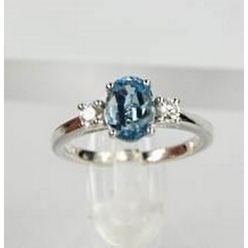 69 - An 18ct white gold, aquamarine and diamond ring, the 1.20ct aquamarine flanked by 0.20cts diamonds i... 